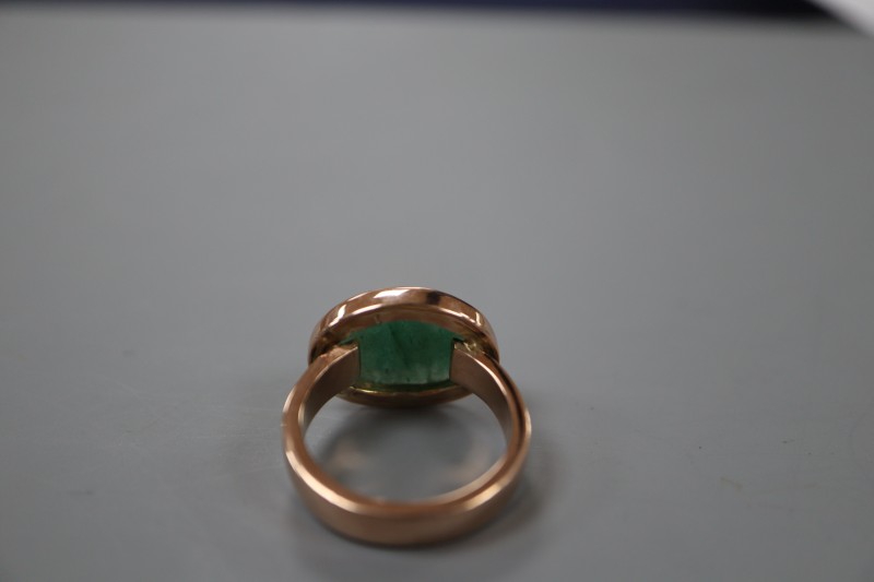 A George V 9ct gold and cabochon green quartz set dress ring, size O, gross weight 7.4 grams.